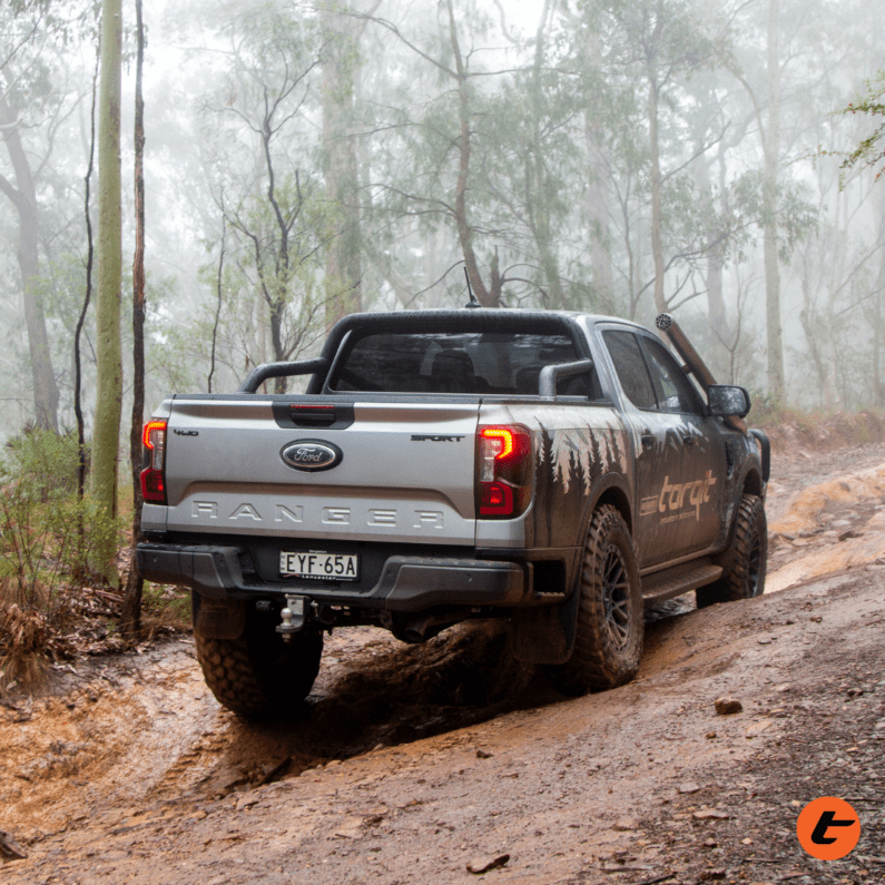 Next Gen Ranger with stainless snorkel and airbox offroad in mud